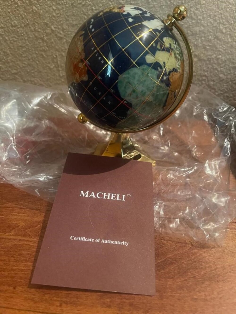 MACHELI LAPIS GEMSTONE SPINNING SMALL GLOBE WITH INLAID STONE ON GOLD TONE BASE